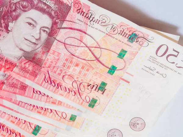 Pound money of United kingdom close up on white, Pound UK note