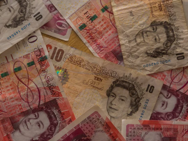 Pound money of United kingdom close up on white, Pound UK note