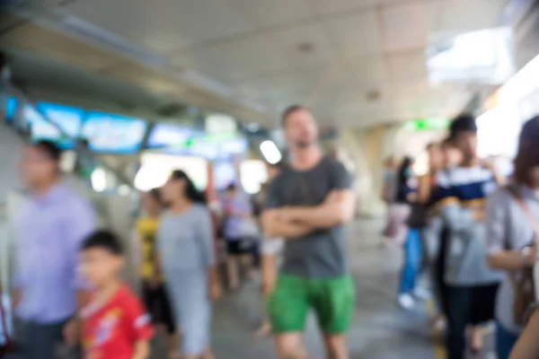 Blurred people movement in BTS sky train station day time