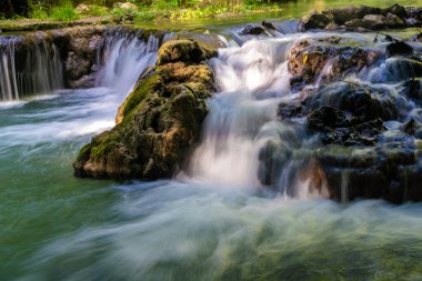 Waterfall in deep tropical rain forest green tree nature scenery
