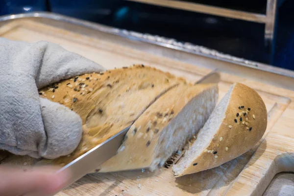 Fresh Various Bread Slice Cutting Knife Wooden Table Hand Close — Fotografia de Stock