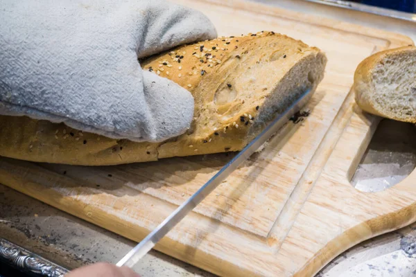 Fresh Various Bread Slice Cutting Knife Wooden Table Hand Close — Stockfoto