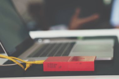 External hard drive connect to laptop computer working on table storage concept