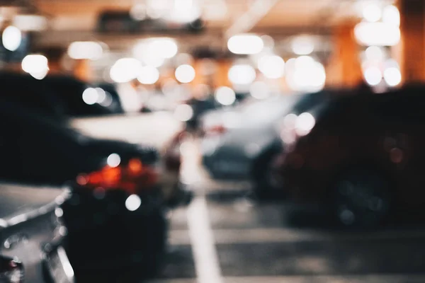 Car parking indoor of supermarket store blurred bokeh with tonned transport background