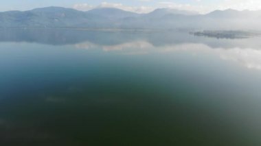 Morning sunrise on river dam with mountain aerial movement view nature scene