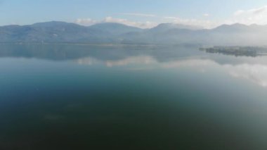 Morning sunrise on river dam with mountain aerial movement view nature scene