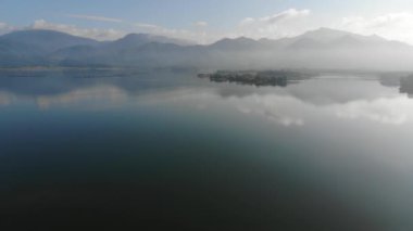 Morning sunrise on river dam with mountain aerial movement view nature scene