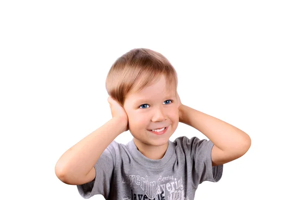 Menino alegre 5 anos fechado pelas orelhas das mãos — Fotografia de Stock