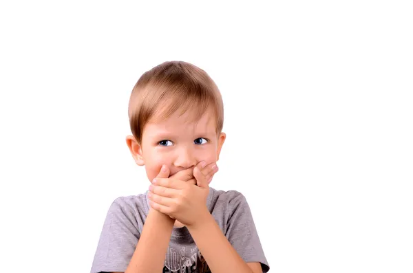 Cheerful boy 5 years shut by the hands mouth — Stok fotoğraf