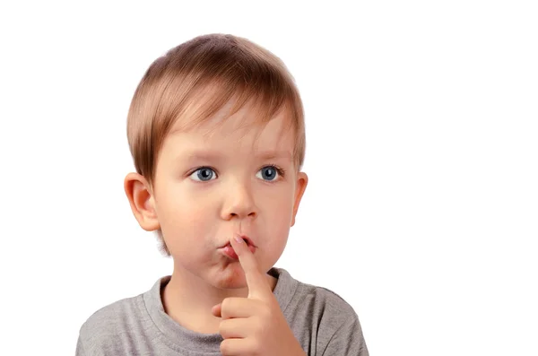 Cut boy covers up his mouth with finger — Stock Photo, Image