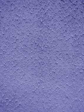 Binanın duvarında sert mavi alçı yüzeyi var. Alçı teknisyeni. Yakın plan. Mavi arkaplan.