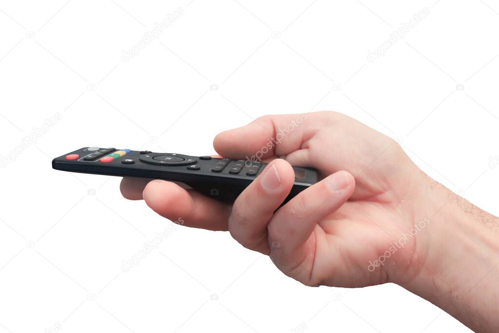A man's hand with a close-up remote control. Black remote control with colored buttons. Isolate on a white background.