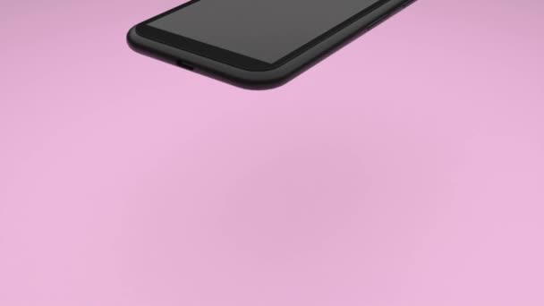 壊れないスマートフォン 黒いスマートフォンはピンクのテーブルの表面に落ち それに跳ね返り 壊れません 3Dレンダリング — ストック動画