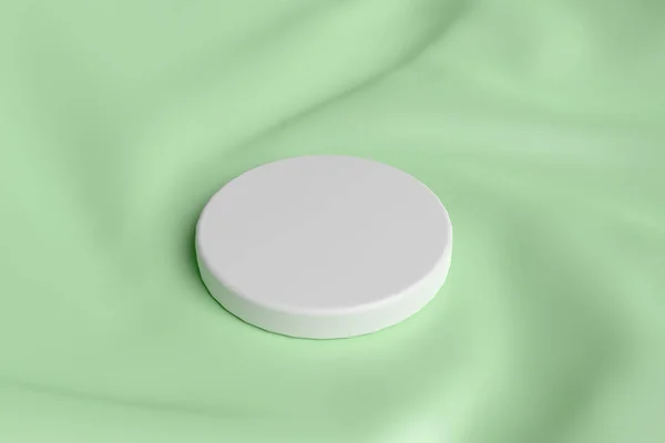 薄緑色の布を中心に円筒形の白い表彰台 アイテムを配置する背景 3Dレンダリング — ストック写真