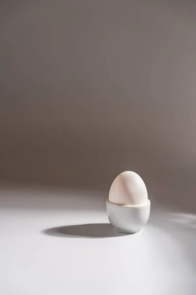 White egg on a white background — Stock Photo, Image