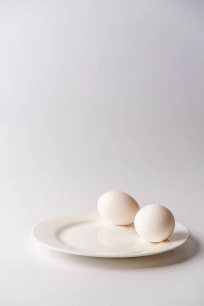 White egg on a white background — Stock Photo, Image