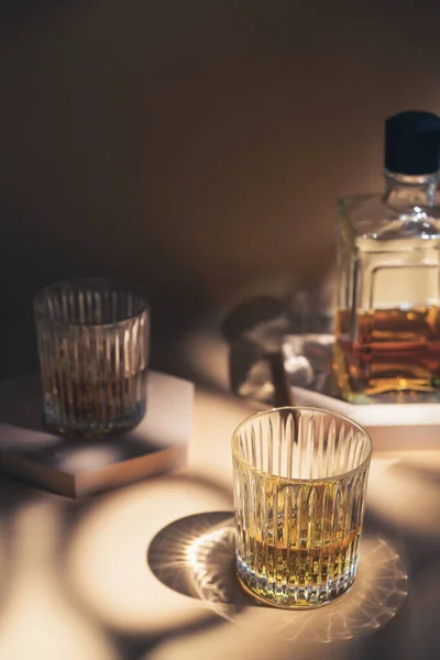 Whiskey with ice in glasses — Stock Photo, Image