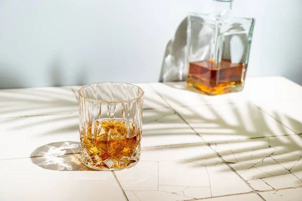 Whiskey with ice in glasses — Stock Photo, Image