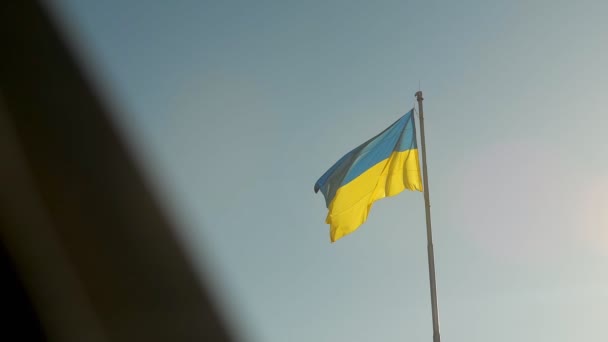 Ukrainian Flag Waving Against Blue Sky. Blue-Yellow Official State Symbol of Ukraine. National Sign slow motion — Stock Video