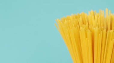 Pasta Spaghetti Close-up on a blue background rotates.