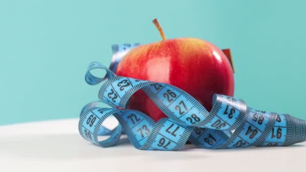 Red Apple Tape Measure Rotate Blue Background Halthy Food Style — Video Stock