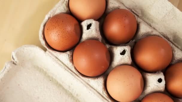 Chicken Eggs Package Wooden Table Rotate Overhead View — Stock Video