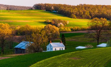 Home and barn on the farm fields and rolling hills of Southern Y clipart