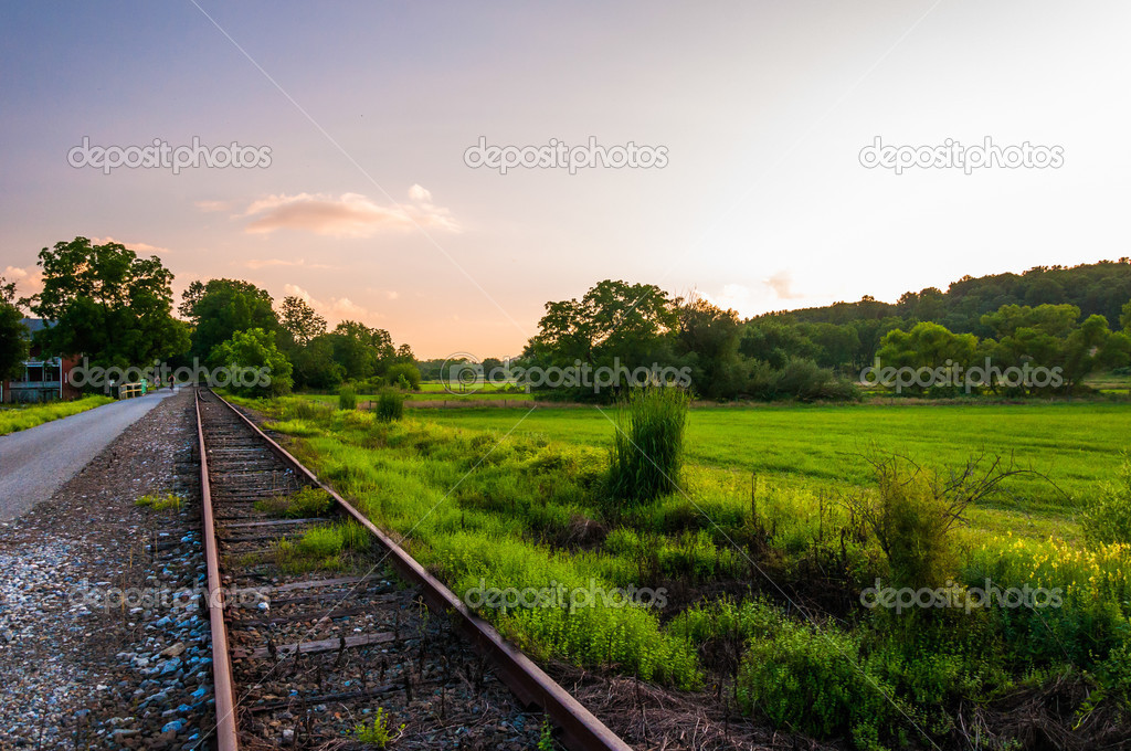 Sunset over railroad tracks and fields in York County, Pennsylva