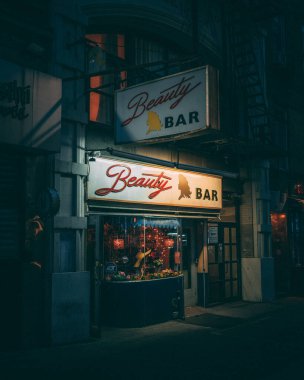 Beauty Bar vintage sign at night, in the East Village, Manhattan, New York