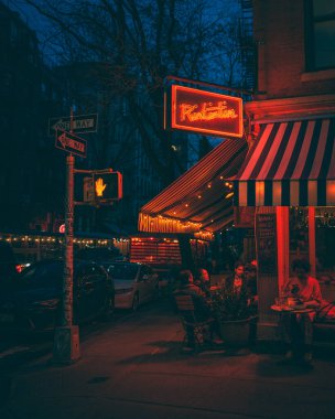 Rintintin neon sign at night, in Nolita, Manhattan, New York