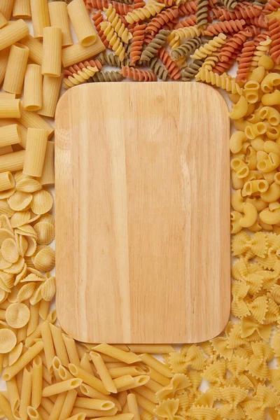 Pasta Concept Light Wooden Cutting Board Being Placed Surrounded Varieties — Stock Photo, Image