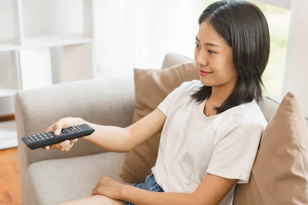 Home Relaxation Concept Young Woman Sit Couch Hold Remote Switch — Stock Photo, Image