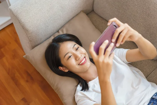 Home Lifestyle Concept Young Woman Lying Couch Use Smartphone Watching — Stock Photo, Image