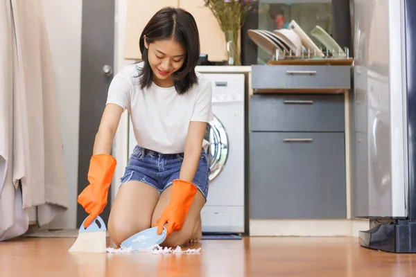 Home Relaxation Concept Young Woman Use Broom Sweeping Garbage Floor — Zdjęcie stockowe