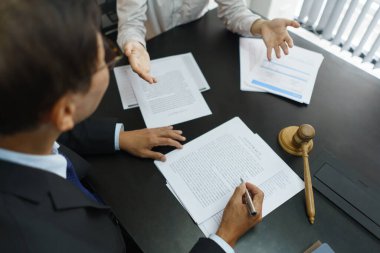 Lawyer and justice concept, Businessman consults senior lawyer for advice on a business contract.