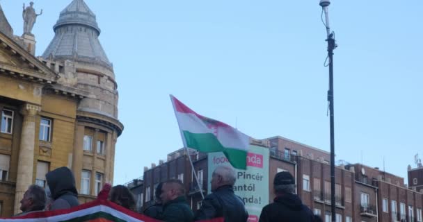 Budapest, Hungary - 22 October 2021: Man with waving Hungarian flag in crowd, Illustrative Editorial — Stock Video