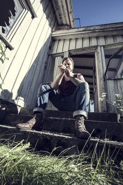 Punk Rocker fires up Cigarette — Stock Photo, Image