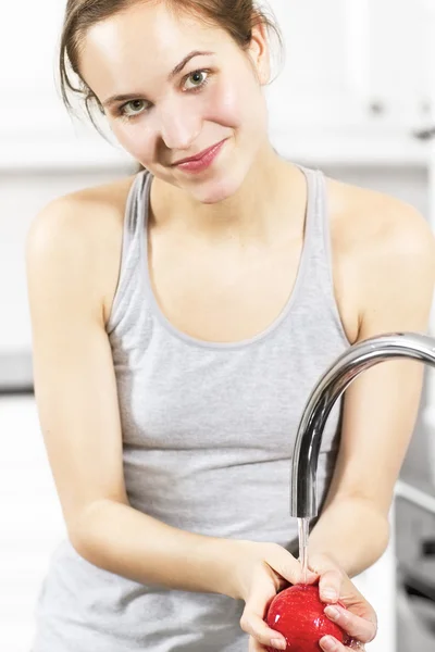 Girl wash an Apple — Stock Photo, Image