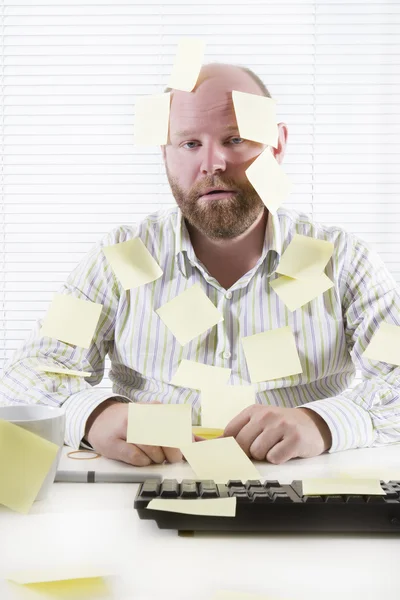 Exhausted Office Worker with Notes Everywhere — Stock Photo, Image