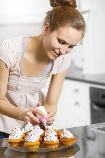 Woman make Muffins Stock Image