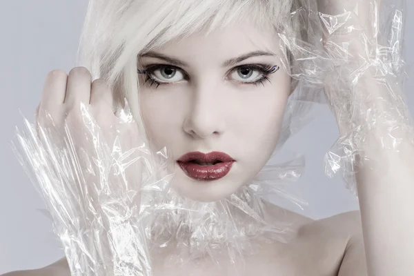 Blonde woman model in plastic — Stock Photo, Image