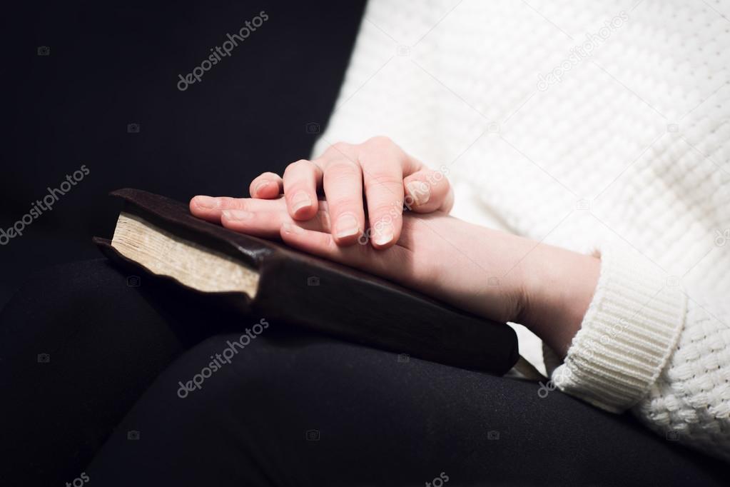 Woman pray with bible