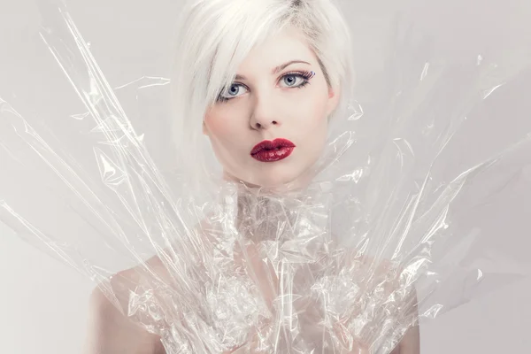 Blonde woman model in plastic — Stock Photo, Image