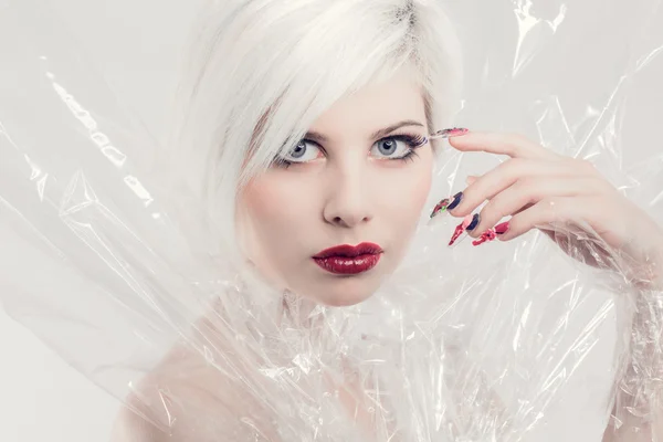 Young blonde woman model in plastic — Stock Photo, Image