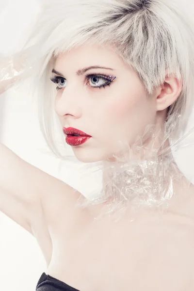 Blonde fashion model in plastic — Stock Photo, Image