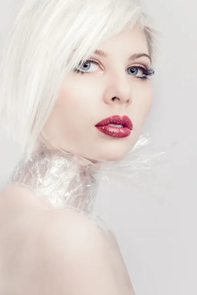 Blonde model girl in plastic — Stock Photo, Image