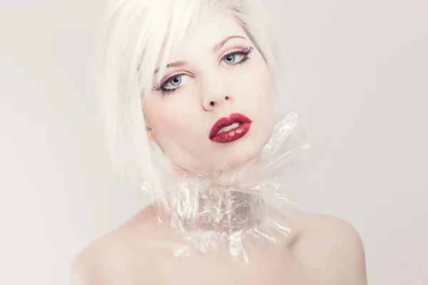 Young blonde model in plastic — Stock Photo, Image