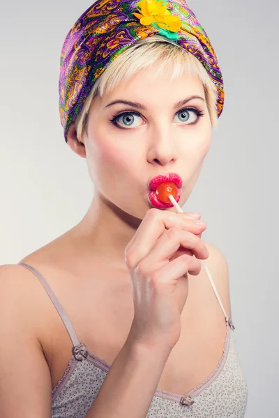 Blue eyed vintage girl with lollipop — Stock Photo, Image