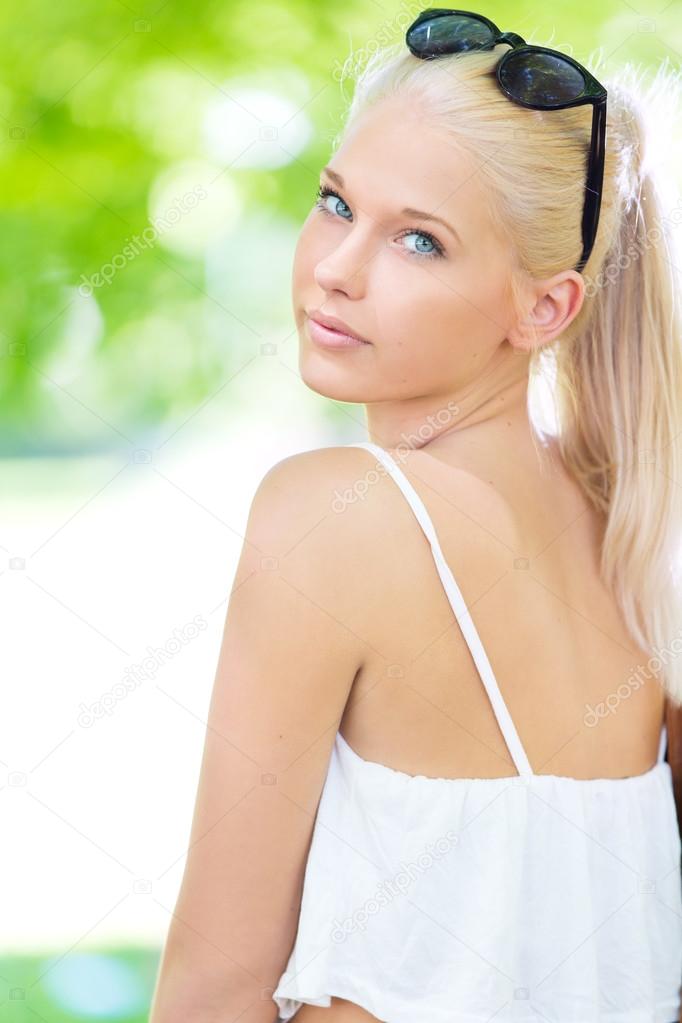 Young and beautiful blonde teenage girl outdoor