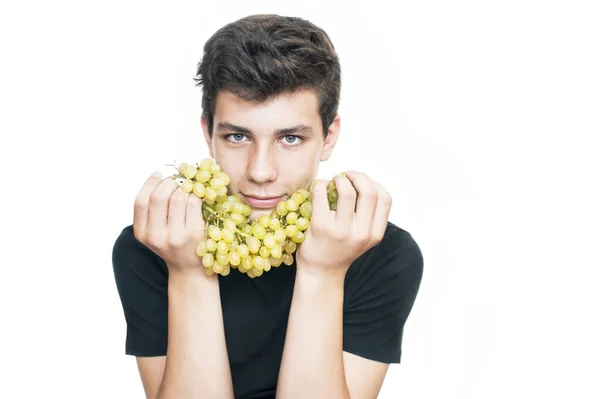 Handsome Teenager Dark Hair Holds Green Grapes White Background Concept —  Fotos de Stock
